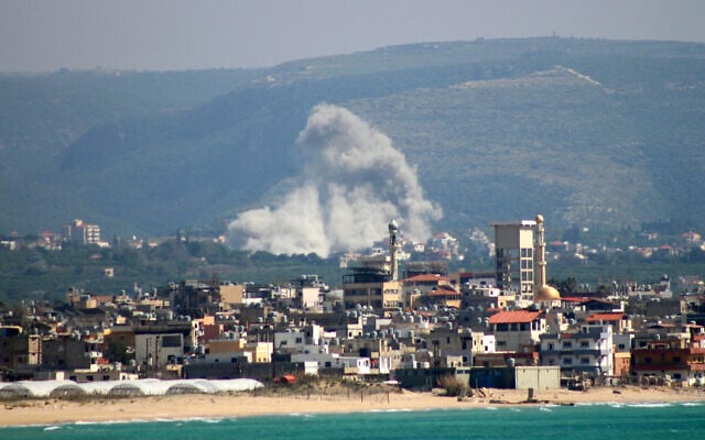 This photograph taken from the southern Lebanese area of Tyre shows smoke rising from the site of an Israeli airstrike that targeted the village of El Qlaile on May 8, 2026. (KAWANT HAJU / AFP)