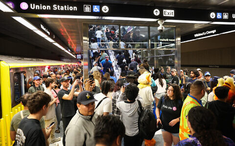 Passengers disembark at the Wilshire/La Cienega station during the opening of the Metro D Line subway extension in Los Angeles on May 8, 2026. (Patrick T. Fallon/AFP)