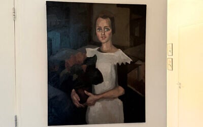This handout photograph taken in an undisclosed area and released by Arthur Brand on May 11, 2026, shows the painting 'Portrait of a Young Girl' by Dutch artist Toon Kelder, an art piece stolen from the world-famous Goudstikker collection by the Nazis, discovered in the house of the descendants of a notorious Dutch SS collaborator (Handout and Arthur BRAND / AFP)