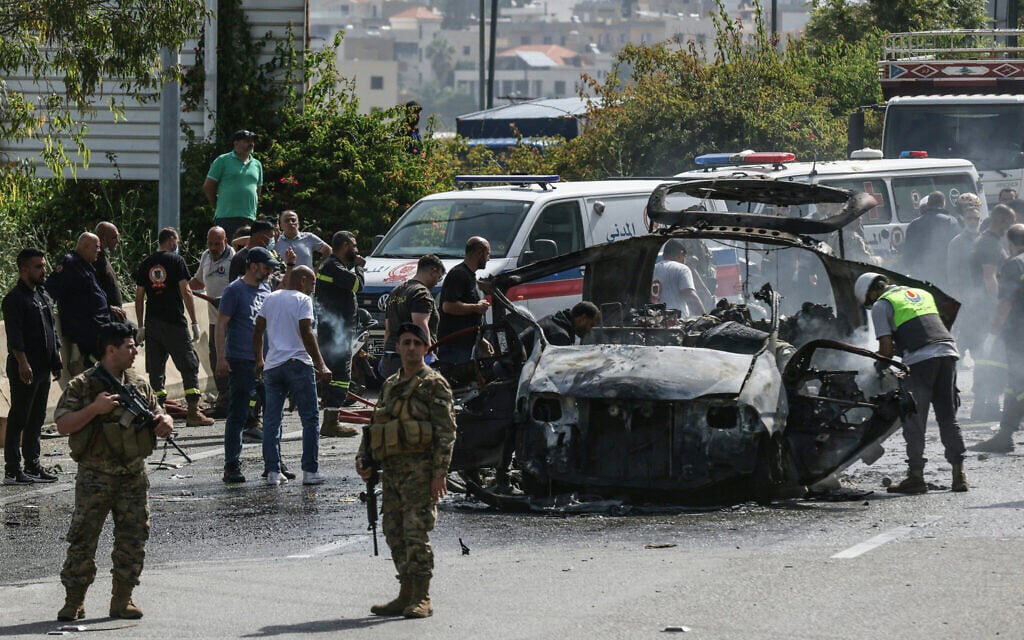 A vehicle targeted by an Israeli drone strike on a highway near the town of Jiyeh, south of Beirut, on May 13, 2026 (MAHMOUD ZAYYAT / AFP)