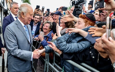 Britain's King Charles III greets Jewish residents in Golders Green in north west London on May 14, 2026. (Photo by Richard Pohle / POOL / AFP)