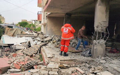 An emergency worker inspects the damage following an Israeli strike on an apartment building in Baalbek, Lebanon, on May 18, 2026. (AFP) An emergency worker inspects the damage following an Israeli strike on an apartment building in Baalbek, Lebanon, on May 18, 2026. (AFP)