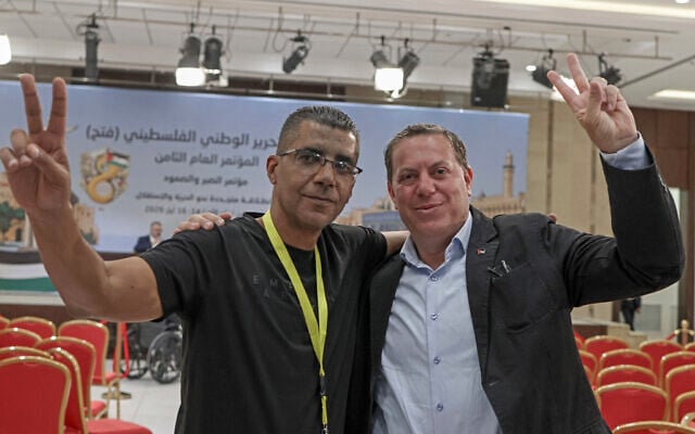 Zakaria Zubeidi, a former commander of the Al-Aqsa Martyrs Brigades, poses with a supporter in Ramallah on May 18, 2026, as initial results emerged from the Palestinian movement's first congress in a decade. (JAAFAR ASHTIYEH / AFP) Zakaria Zubeidi, a former commander of the Al-Aqsa Martyrs Brigades, poses with a supporter in Ramallah on May 18, 2026, as initial results emerged from the Palestinian movement's first congress in a decade. (JAAFAR ASHTIYEH / AFP)