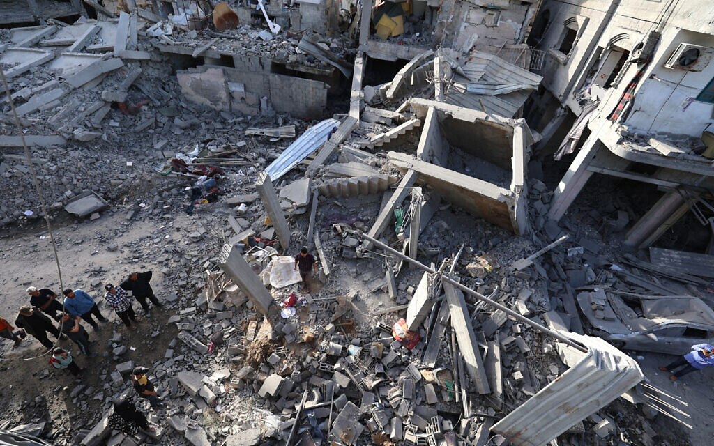 Palestinians inspect the remains of a building the day after it was targeted in an Israeli strike in the central Gaza Strip on May 20, 2026 (Eyad Baba / AFP) Palestinians inspect the remains of a building the day after it was targeted in an Israeli strike in the central Gaza Strip on May 20, 2026 (Eyad Baba / AFP)