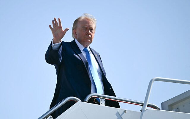 US President Donald Trump waves as he boards Air Force One at Joint Base Andrews, Maryland on May 20, 2026. (Kent NISHIMURA / AFP) US President Donald Trump waves as he boards Air Force One at Joint Base Andrews, Maryland on May 20, 2026. (Kent NISHIMURA / AFP)