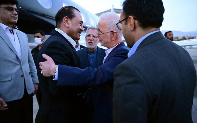 This handout photograph taken and released on May 22, 2026 by Pakistan's Inter-Services Public Relations (ISPR) shows visiting Pakistan's Army Chief Syed Asim Munir (2nd L) being greeted by Iran's Interior Minister Eskandar Momeni upon his arrival in Tehran as part of ongoing mediation efforts between Iran and the United States. (Inter-Services Public Relations / AFP)