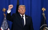 US President Donald Trump raises a fist as he departs after delivering a speech about the economy at Rockland Community College Fieldhouse in Suffern, New York, on May 22, 2026. (Brendan SMIALOWSKI / AFP)