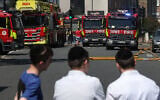 Local residents look at fire trucks at the site of a fire which broke out at a supermarket in the Golders Green neighbourhood in north London on May 27, 2026.  (Photo by Toby Shepheard / AFP)