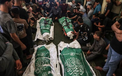 Mourners gather prior to the burial of Hamas leader Mohammed Odeh and his family members, during their funeral in Gaza City on May 27, 2026. (Omar AL-QATTAA / AFP)