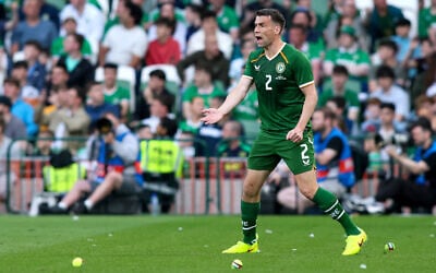 Republic of Ireland's defender Seamus Coleman reacts as tennis balls with Palestinian flags on them are thrown onto the pitch during the international friendly soccer match between the Republic of Ireland and Qatar, at the Aviva Stadium in Dublin, Ireland on May 28, 2026. (Paul Faith/AFP) Republic of Ireland's defender Seamus Coleman reacts as tennis balls with Palestinian flags on them are thrown onto the pitch during the international friendly soccer match between the Republic of Ireland and Qatar, at the Aviva Stadium in Dublin, Ireland on May 28, 2026. (Paul Faith/AFP)