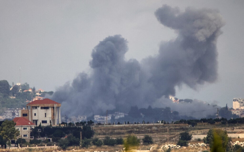 A photograph taken from the Marjayoun area in southern Lebanon shows smoke rising after an Israeli air strike on the village of Mayfadoun on May 30, 2026. (AFP)
