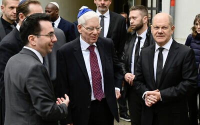 The managing director of the Central Council of Jews in Germany Daniel Botmann, left, and the President of the Central Council of Jews in Germany Josef Schuster greet German Chancellor Olaf Scholz, right, prior to a ceremony to mark the 85th anniversary of Kristallnacht in the Beth Zion synagogue in Berlin, Thursday, Nov. 9, 2023. (John Macdougall/Pool Photo via AP)