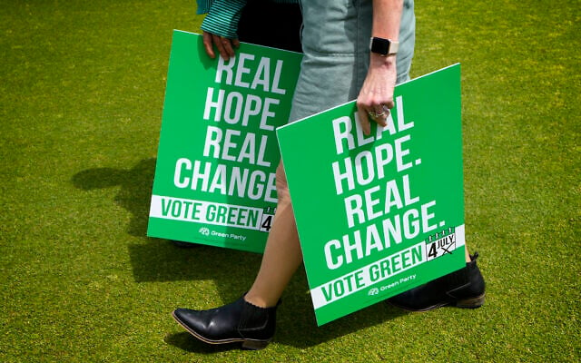 Green Party supporters carry placards at their General Election Manifesto launch - Real Hope, Real Change, at Sussex County Cricket Ground in Hove, East Sussex, England, June 12, 2024.(Kirsty Wigglesworth/AP) Green Party supporters carry placards at their General Election Manifesto launch - Real Hope, Real Change, at Sussex County Cricket Ground in Hove, East Sussex, England, June 12, 2024.(Kirsty Wigglesworth/AP)