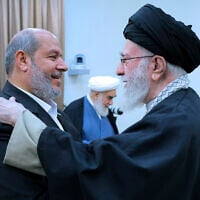 In this photo released by an official website of the office of the Iranian supreme leader, Supreme Leader Ayatollah Ali Khamenei, right, greets Khalil al-Hayya, a member of Hamas leadership council during their meeting in Tehran, Iran, Saturday, Feb. 8, 2025. (Office of the Iranian Supreme Leader via AP)