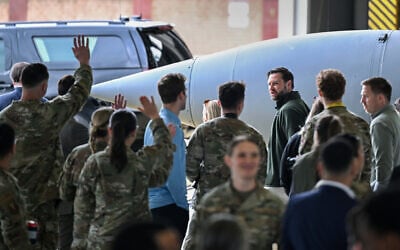 US Vice President JD Vance visits with service members during a refueling stop at Ramstein Air Base, Germany, April 24, 2025. (Kenny Holston/Pool Photo via AP)