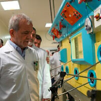 In this photo released on November 2, 2025, by the Atomic Energy Organization of Iran, President Masoud Pezeshkian visits the country's nuclear facilities during his tour to the Atomic Energy Organization in Tehran, Iran. (Atomic Energy Organization of Iran via AP)