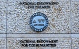 The official seal of the US National Endowment for the Arts and the National Endowment for the Humanities is seen on an office building in Washington, February 13, 2026. (AP Photo/Cliff Owen)