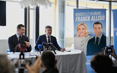 Far-right party National Rally president Jordan Bardella, left, attends a press conference to support far-right candidate for Marseille mayoral election, Franck Allisio, right, in Marseille, south of France, on March 6, 2026. (AP Photo/Philippe Magoni)