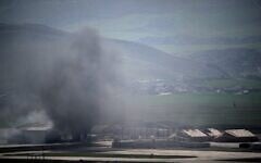 Smoke rises to the sky at an air base following attacks early morning, in Harir, Iraq, March 12, 2026. (AP/Leo Correa)