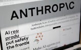 Pages from the Anthropic website and the company's logo are displayed on a computer screen in New York on February 26, 2026. (AP Photo/Patrick Sison)