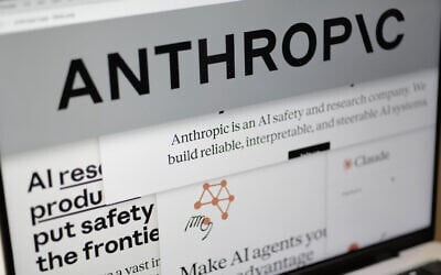 Pages from the Anthropic website and the company's logo are displayed on a computer screen in New York on February 26, 2026. (AP Photo/Patrick Sison)