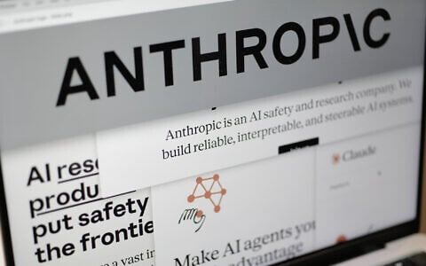 Pages from the Anthropic website and the company's logo are displayed on a computer screen in New York on February 26, 2026. (AP Photo/Patrick Sison)