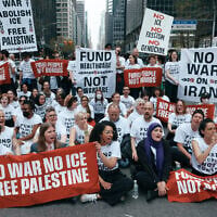 Chelsea Manning, bottom second left, Linda Sarsour, bottom second right, and protesters with Jewish Voice for Peace block traffic during a demonstration outside the New York office of US Senator Chuck Schumer, calling for an end to the US-Israel war with Iran, American support for Israel, and the Immigrations and Customs Enforcement agency on April 13, 2026, in New York. (AP Photo/Andres Kudacki)