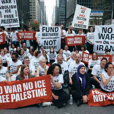 Chelsea Manning, bottom second left, Linda Sarsour, bottom second right, and protesters with Jewish Voice for Peace block traffic during a demonstration outside the New York office of US Senator Chuck Schumer, calling for an end to the US-Israel war with Iran, American support for Israel, and the Immigrations and Customs Enforcement agency on April 13, 2026, in New York. (AP Photo/Andres Kudacki)