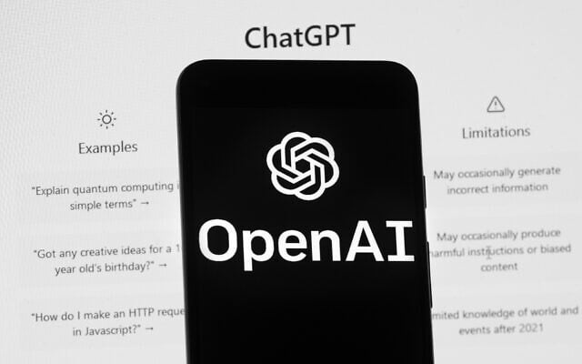 The OpenAI logo is seen on a mobile phone in front of a computer screen which displays the ChatGPT home Screen, March 17, 2023, in Boston, Massachusetts. (AP Photo/Michael Dwyer) The OpenAI logo is seen on a mobile phone in front of a computer screen which displays the ChatGPT home Screen, March 17, 2023, in Boston, Massachusetts. (AP Photo/Michael Dwyer)