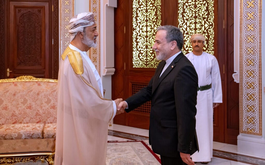 Iranian Foreign Minister Abbas Araghchi, right, shakes hands with Oman's Sultan Haitham bin Tariq during their meeting in Muscat, Oman, April 26, 2026. (Iranian Foreign Ministry via AP)