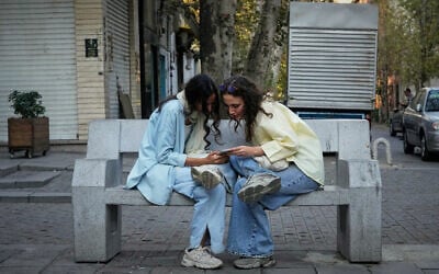Two women use a smartphone in northern Tehran, Iran, September 28, 2025. (AP Photo/Vahid Salemi, File) Two women use a smartphone in northern Tehran, Iran, September 28, 2025. (AP Photo/Vahid Salemi, File)