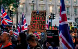Protesters gather near Downing Street during a “national emergency” rally organized by the Campaign Against Antisemitism following a knife attack in Golders Green, in London, April 30, 2026. (AP Photo/Alberto Pezzali)