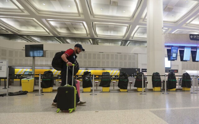 A traveler walks past covered Spirit Airlines kiosks, May 2, 2026, at George Bush Intercontinental Airport, in Houston. (AP Photo/Lekan Oyekanmi) A traveler walks past covered Spirit Airlines kiosks, May 2, 2026, at George Bush Intercontinental Airport, in Houston. (AP Photo/Lekan Oyekanmi)