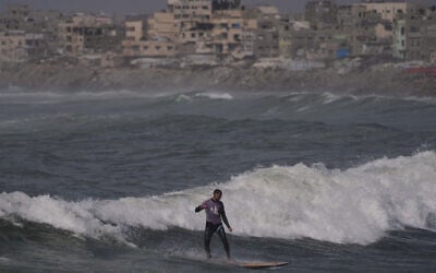 Palestinian Tahseen Abu Assi rides a wave at a beach along the Mediterranean Sea in Gaza City, Monday, May 4, 2026. (AP Photo/Jehad Alshrafi) Palestinian Tahseen Abu Assi rides a wave at a beach along the Mediterranean Sea in Gaza City, Monday, May 4, 2026. (AP Photo/Jehad Alshrafi)