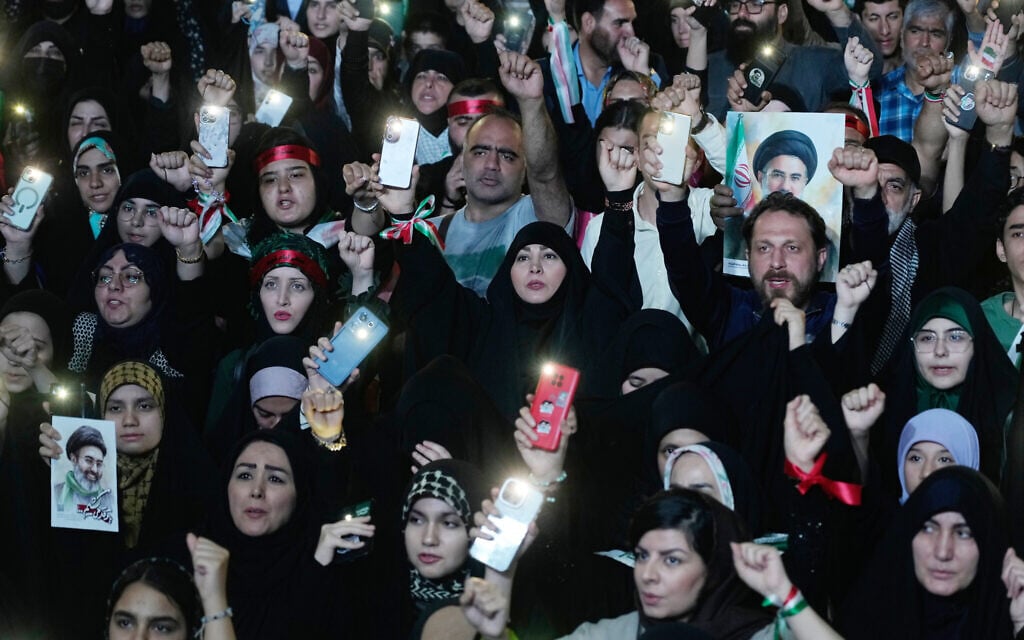 Pro-government demonstrators chant slogans holding posters of the Iranian Supreme Leader Ayatollah Mojtaba Khamenei during their gathering at Enqelab-e-Eslami, or Islamic Revolution, square in Tehran, Iran, on May 4, 2026. (AP Photo/Vahid Salemi)