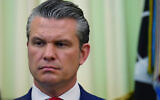 US Defense Secretary Pete Hegseth listens as President Donald Trump speaks before signing a proclamation in the Oval Office at the White House, in Washington, May 5, 2026. (Jacquelyn Martin/AP)