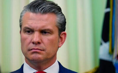 US Defense Secretary Pete Hegseth listens as President Donald Trump speaks before signing a proclamation in the Oval Office at the White House, in Washington, May 5, 2026. (Jacquelyn Martin/AP)