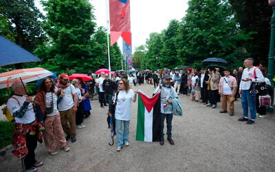 A group gathers with a Palestinian flag in front of the main entrance wearing the names of artists who have been killed in Gaza, at the Venice 2026 Biennale Art, Italy, May 5, 2026. (AP Photo/Luca Bruno) A group gathers with a Palestinian flag in front of the main entrance wearing the names of artists who have been killed in Gaza, at the Venice 2026 Biennale Art, Italy, May 5, 2026. (AP Photo/Luca Bruno)
