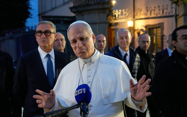 Pope Leo XIV talks to journalists as he leaves his residence in Castel Gandolfo, on the outskirts of Rome, to return to the Vatican, May 5, 2026. (AP/Gregorio Borgia)
