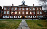 FILE - Lights glow in Rutgers University's Old Queens building, April 4, 2013, in New Brunswick, NJ. (AP Photo/Mel Evans, File)