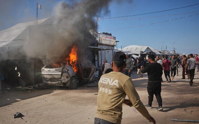 Palestinians gather around a vehicle targeted by an Israeli airstrike in Khan Younis, southern Gaza Strip, May 6, 2026. (AP Photo/Abdel Kareem Hana) Palestinians gather around a vehicle targeted by an Israeli airstrike in Khan Younis, southern Gaza Strip, May 6, 2026. (AP Photo/Abdel Kareem Hana)