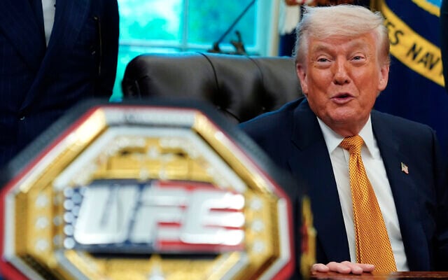 US President Donald Trump meets with UFC fighters, May 6, 2026, in the Oval Office of the White House, in Washington. (AP Photo/Jacquelyn Martin)