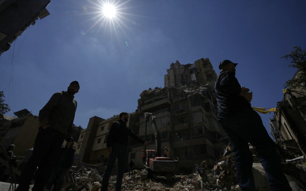 Rescue workers search through the rubble of a building destroyed in an Israeli airstrike the previous day in Dahiyeh, Beirut's southern suburbs, Lebanon, May 7, 2026. (AP/Bilal Hussein)