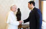 Pope Leo XIV, left, greets US Secretary of State Marco Rubio upon his arrival for talks in the pope's private library at the Vatican, May 7, 2026. (Vatican Media via AP)