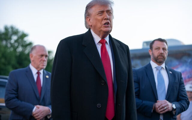 US President Donald Trump, center, flanked by White House border czar Tom Homan, left, and US Homeland Security Secretary Markwayne Mullin, right, talks as he visits the Lincoln Memorial Reflecting Pool in Washington, DC, to see the new blue protective coating being applied as part of a renovation project, May 7, 2026. (AP/Mark Schiefelbein) US President Donald Trump, center, flanked by White House border czar Tom Homan, left, and US Homeland Security Secretary Markwayne Mullin, right, talks as he visits the Lincoln Memorial Reflecting Pool in Washington, DC, to see the new blue protective coating being applied as part of a renovation project, May 7, 2026. (AP/Mark Schiefelbein)