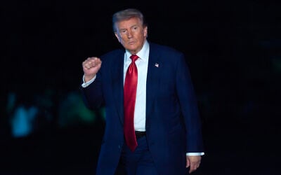 US President Donald Trump waves to reporters as he walks on the South Lawn upon his arrival to the White House, May 8, 2026, in Washington. (AP/Jose Luis Magana)