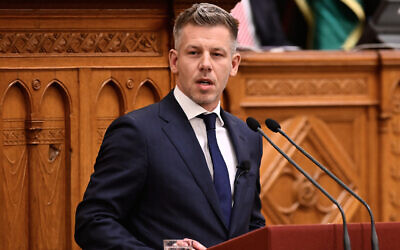 Peter Magyar takes the oath as Hungary's prime minister during a ceremony in Budapest, Hungary, May 9, 2026. (AP Photo/Denes Erdos)