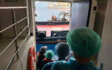 Passengers are being disembarked from the hantavirus-stricken cruise ship MV Hondius at the port of Granadilla in Tenerife, Canary Islands, Spain, May 10, 2026. (AP Photo)