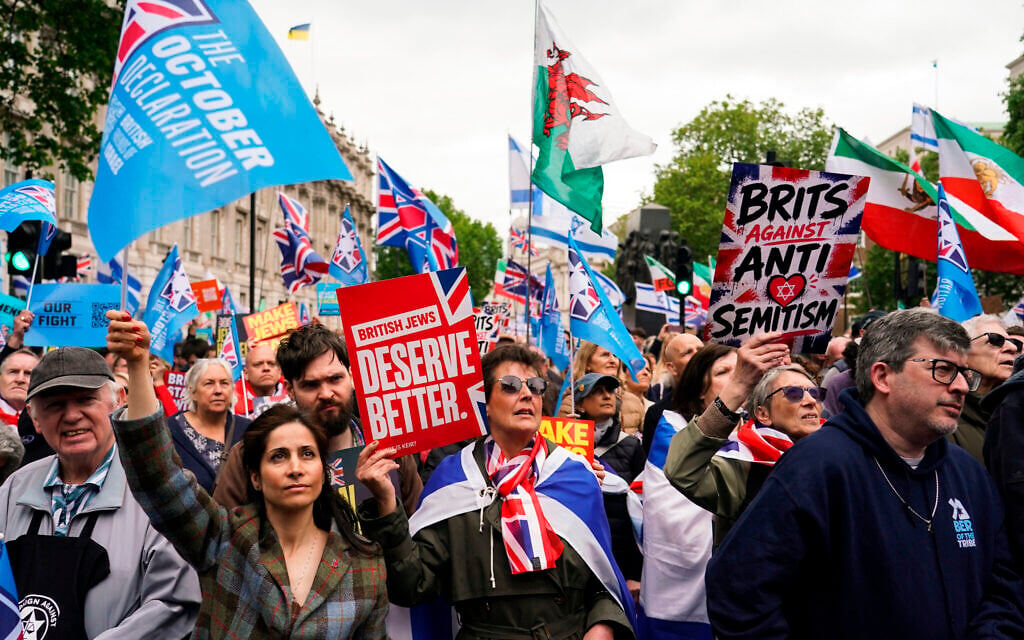 Demonstrators gather holding flags and placards as they attend a protest against antisemitism and extremism, in London, May 10, 2026.(AP Photo/Alberto Pezzali)