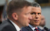 US Defense Secretary Pete Hegseth, right, watches as acting Under Secretary of Defense and Comptroller Jules Hurst III testifies at a House Appropriations subcommittee budget hearing for the US Department of Defense, on Capitol Hill in Washington, May 12, 2026. (AP Photo/Alex Brandon)